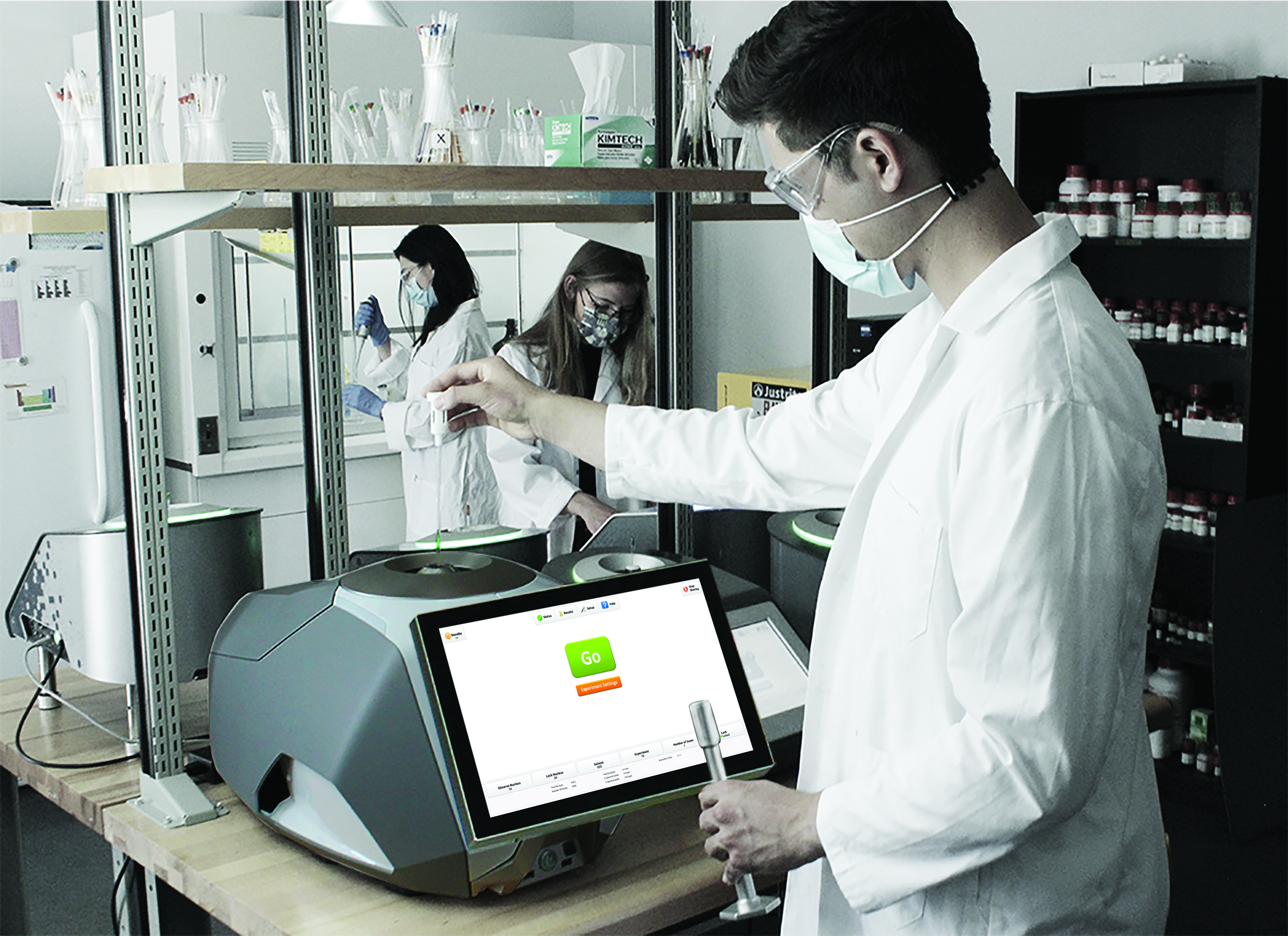Nanalysis-100-MHz-benchtop-NMR-3-chemists-lab-in-action